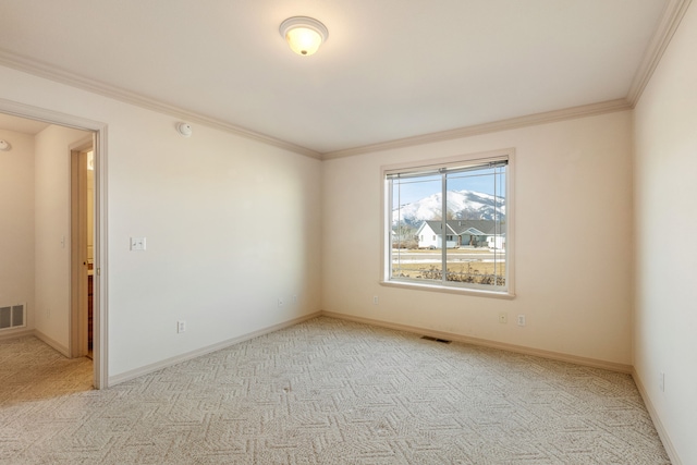 unfurnished room featuring baseboards, visible vents, carpet flooring, and ornamental molding