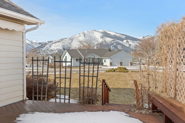 view of yard featuring a deck with mountain view