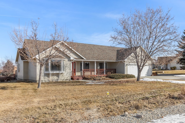 ranch-style home with an attached garage, covered porch, concrete driveway, roof with shingles, and a front yard