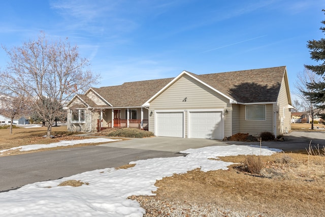 single story home featuring a garage, driveway, a porch, and a shingled roof