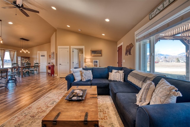 living area with a ceiling fan, vaulted ceiling, wood finished floors, and recessed lighting