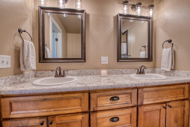 full bath featuring double vanity and a sink