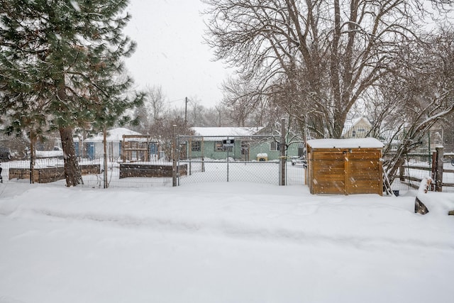 snowy yard with fence