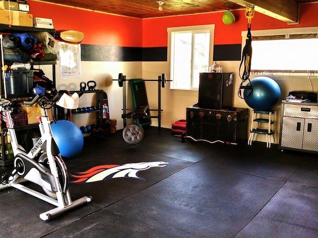 exercise room with wooden ceiling