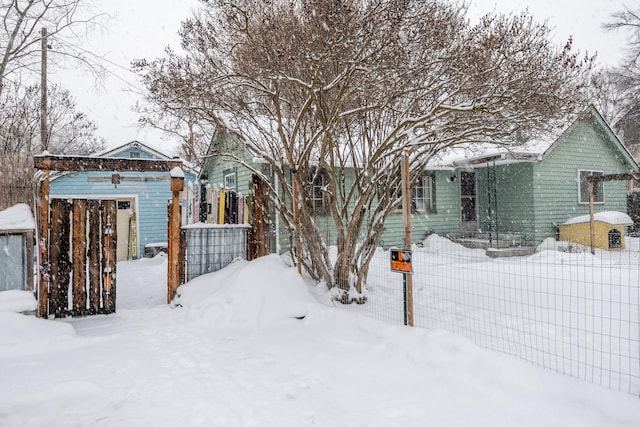 ranch-style home with fence