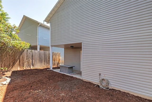 view of property exterior with fence