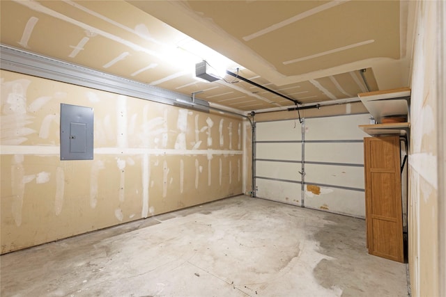 garage with electric panel and a garage door opener