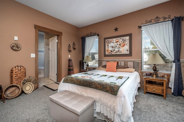 bedroom with carpet flooring and ensuite bathroom