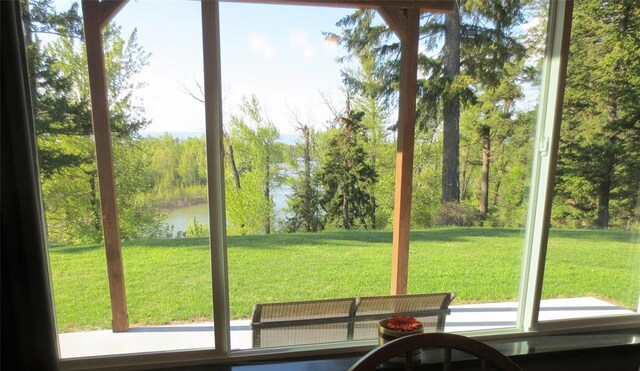 doorway to outside featuring a water view