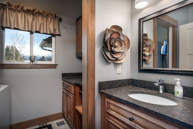 bathroom featuring vanity and baseboards