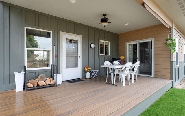 wooden deck with outdoor dining area