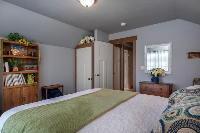 bedroom with lofted ceiling