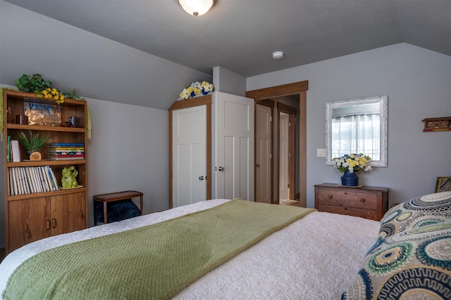 bedroom featuring lofted ceiling