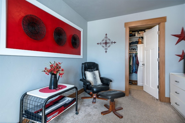 sitting room with carpet flooring and baseboards