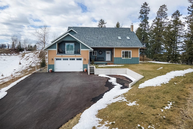 view of front of house with aphalt driveway, roof with shingles, an attached garage, a balcony, and a chimney