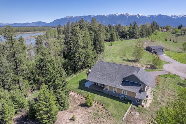 view of subject property with a water and mountain view