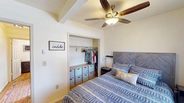 bedroom with a closet, a ceiling fan, and beamed ceiling