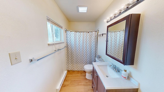 bathroom with toilet, a baseboard radiator, wood finished floors, curtained shower, and vanity