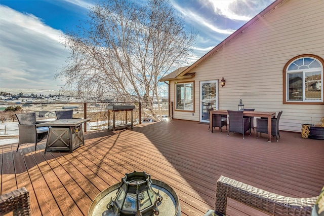 wooden deck with outdoor dining area