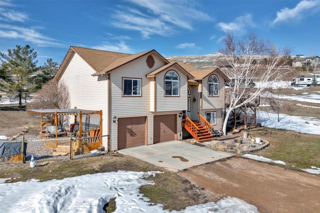 split foyer home featuring driveway and an attached garage