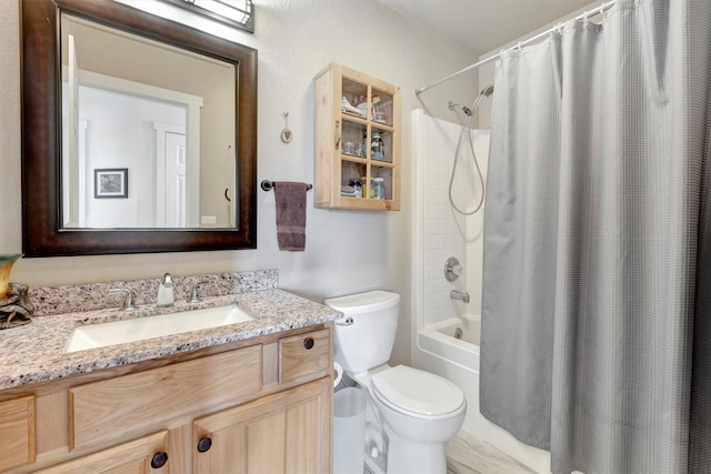 full bath featuring toilet, shower / tub combo, and vanity