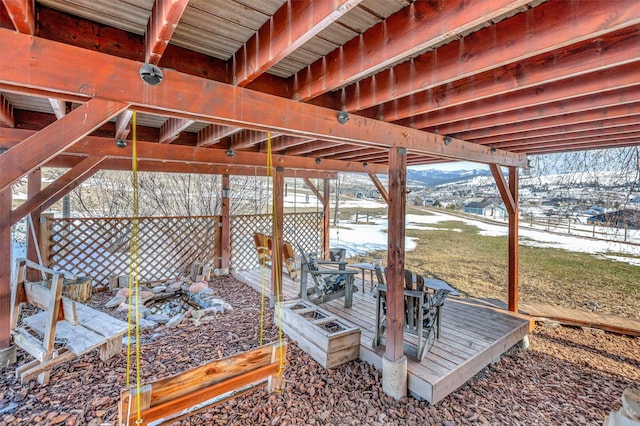 snow covered patio featuring outdoor dining area and a mountain view