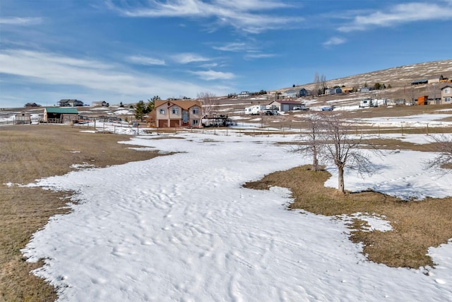 view of yard covered in snow