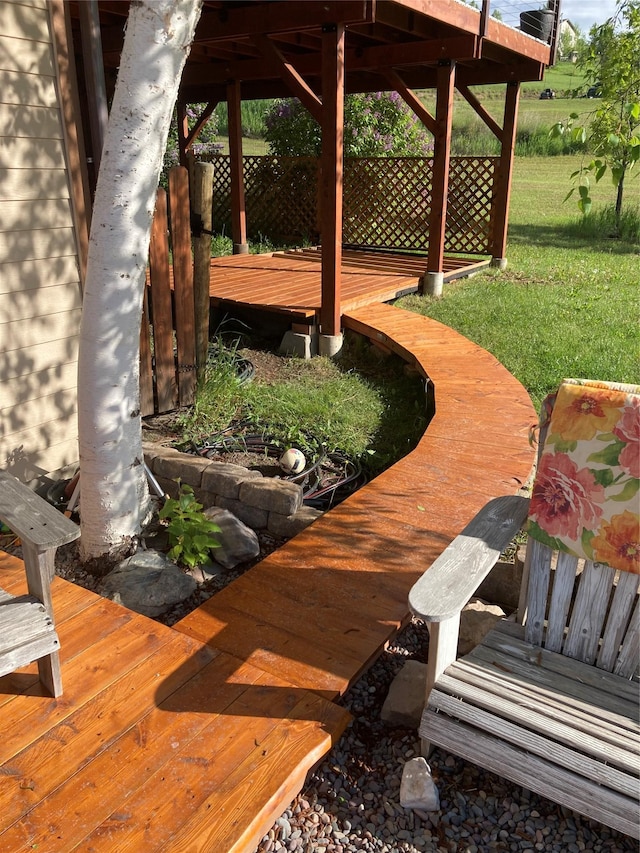 exterior space featuring a lawn and a wooden deck