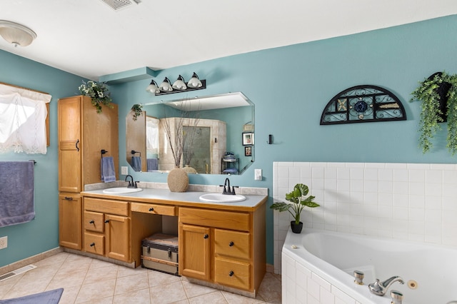 bathroom featuring a stall shower, visible vents, a sink, and a whirlpool tub