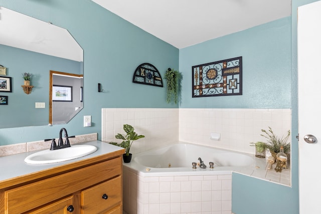 bathroom featuring a whirlpool tub and vanity