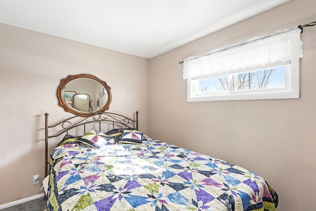 carpeted bedroom with baseboards