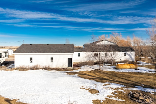 view of snow covered house