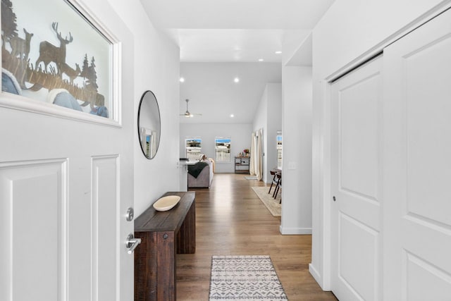 entrance foyer with baseboards, a ceiling fan, lofted ceiling, wood finished floors, and recessed lighting