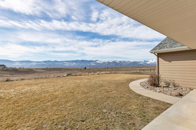 view of yard featuring a mountain view and a rural view