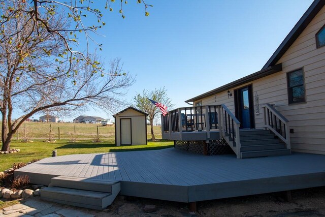 deck with an outdoor structure, a shed, and a lawn