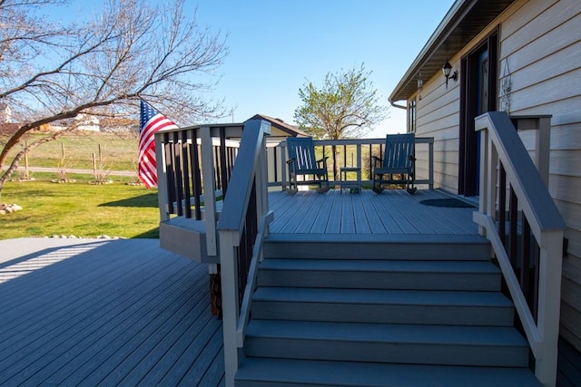 deck featuring a lawn