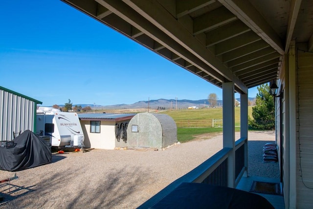 view of patio / terrace with a mountain view