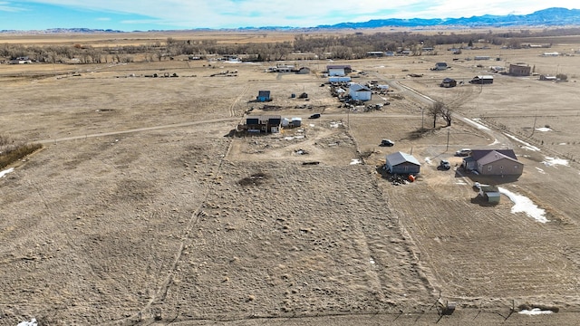 drone / aerial view with a mountain view and a rural view