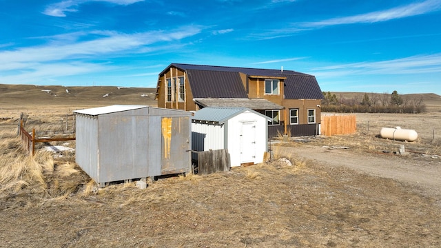 view of shed featuring fence