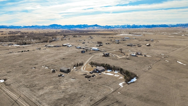 birds eye view of property featuring a mountain view