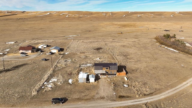 birds eye view of property featuring a rural view