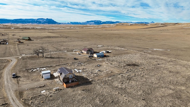 birds eye view of property featuring a rural view and a mountain view