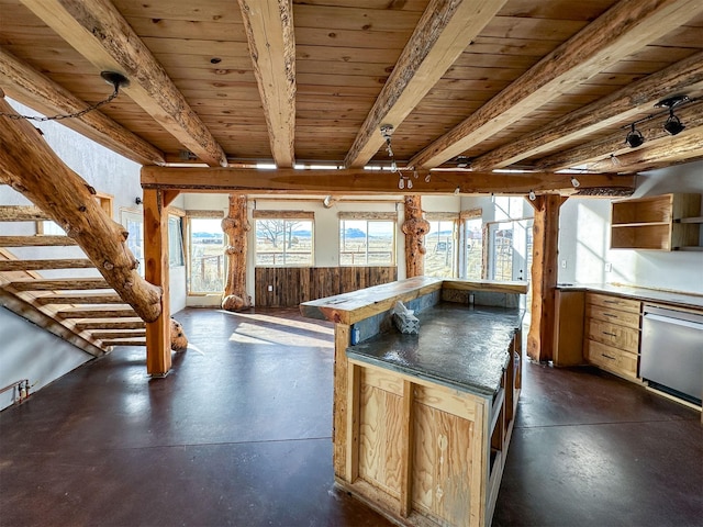 kitchen with wooden ceiling, beam ceiling, a kitchen island, and concrete flooring