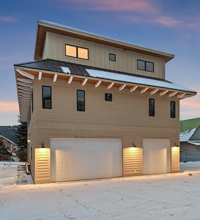 view of front of home with a garage and board and batten siding