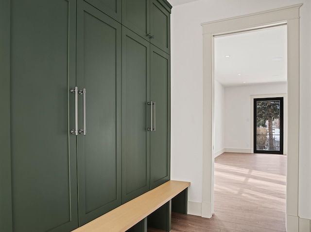 mudroom with baseboards and wood finished floors