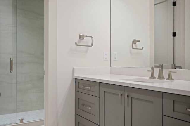 bathroom featuring a stall shower and vanity