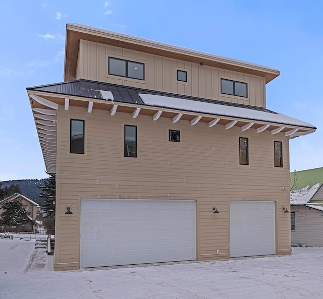 exterior space featuring a garage and board and batten siding