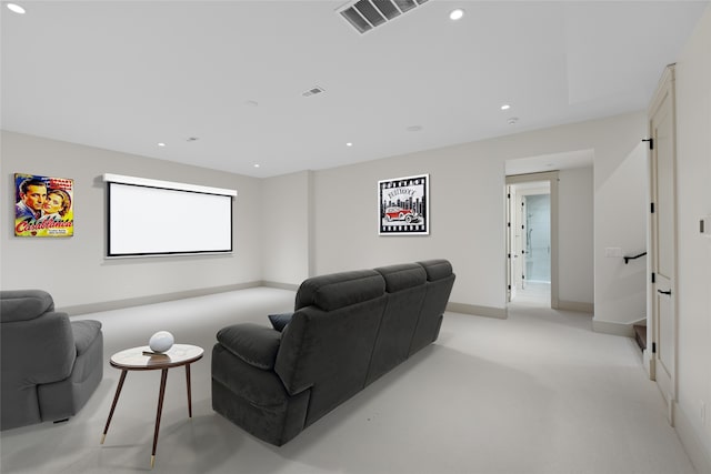 home theater room featuring light colored carpet, recessed lighting, visible vents, and baseboards