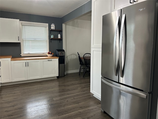 kitchen featuring dark wood finished floors, freestanding refrigerator, white cabinetry, open shelves, and wooden counters