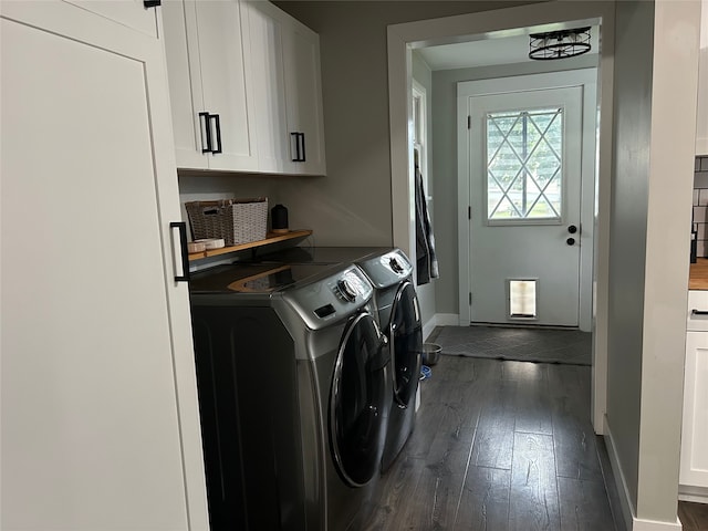 washroom with baseboards, cabinet space, dark wood finished floors, and washing machine and clothes dryer